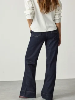 Blauw met wassing - Jeans met wijde pijpen en gouden knopen aan de voorkant