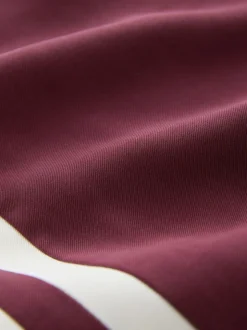 Bordeauxrood - Wijduitlopende broek met streep langs de zijkanten