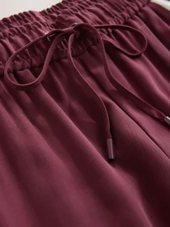 Bordeauxrood - Wijduitlopende broek met streep langs de zijkanten
