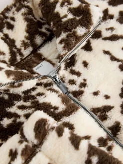 Bruin met koeprint - Borg fleece met korte rits