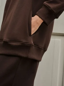 Chocoladebruin - Essentials sweatshirt met relaxte pasvorm, lange snit en zakken