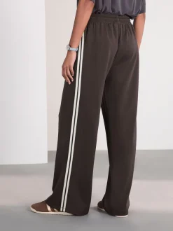 Chocoladebruin - Slinky trainingsbroek met wijde pijpen en zijstrepen