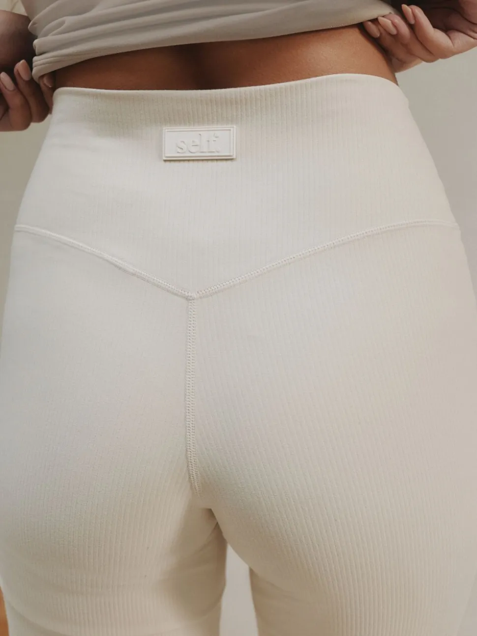 Ecru - self. Geribde wijde legging