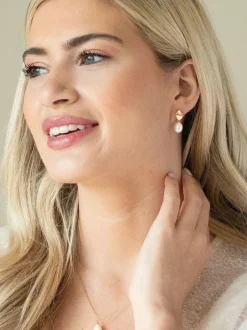 Goud - Ivory & Co moderne oorhangers met pareleffect