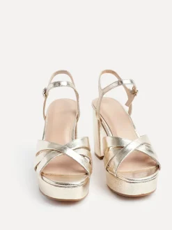 Goud - Linzi Keliah sandalen met plateauzool, gekruiste bandjes en blokhak