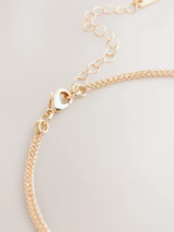 Goudkleurig - Gelaagde ketting met glinsterende blaadjes