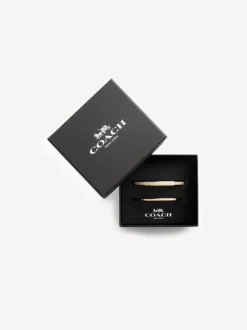 Goudkleurig/wit - COACH COACH goudkleurige Signature Duo Bangle set in doosje