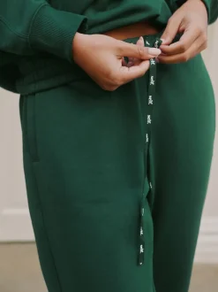 Groen - Self. joggingbroek met boorden
