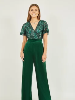 Groen - Yumi jumpsuit met engelmouwen, van fluweel en versierd met lovertjes
