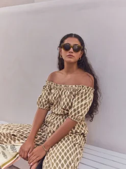 Kakigroen - Jumpsuit met blote schouders en wijde pijpen van 100% katoen