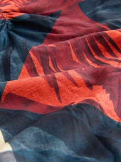 Marineblauw/oranje met palmprint - Vormgevend bandeaubadpak met buikcorrectie