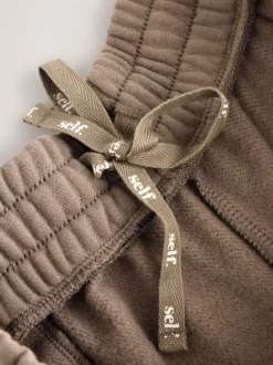 Nertsgrijs/bruin - self. joggingbroek met wijde pijpen