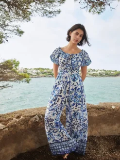 Wit/zwart - Jumpsuit met blote schouder