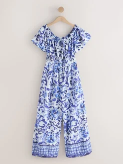 Wit/zwart - Jumpsuit met blote schouder