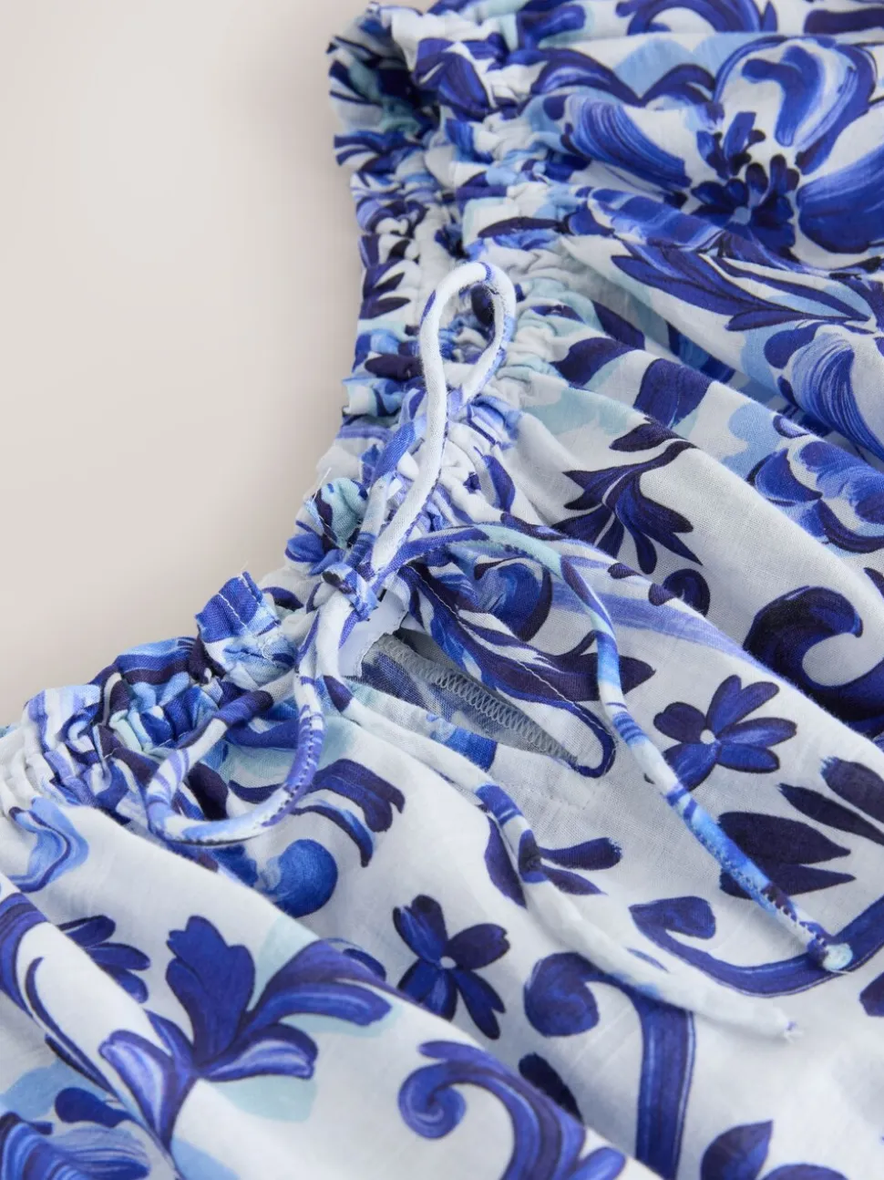 Wit/zwart - Jumpsuit met blote schouder