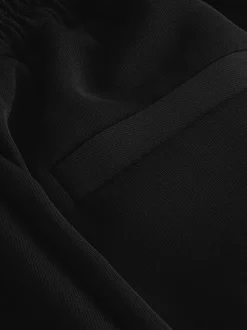 Zwart - Broek met wijde pijpen en elastiek in de achterkant