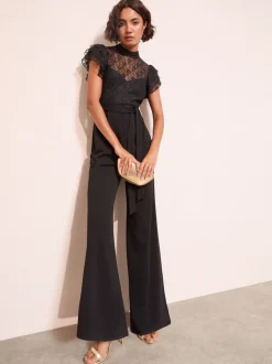 Zwart - Friends Like These jumpsuit van kant en scubamix met ruches aan de mouwen