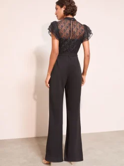 Zwart - Friends Like These jumpsuit van kant en scubamix met ruches aan de mouwen
