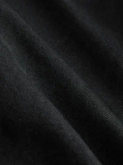 Zwart - Jeans met wijde pijpen en gouden knopen aan de voorkant