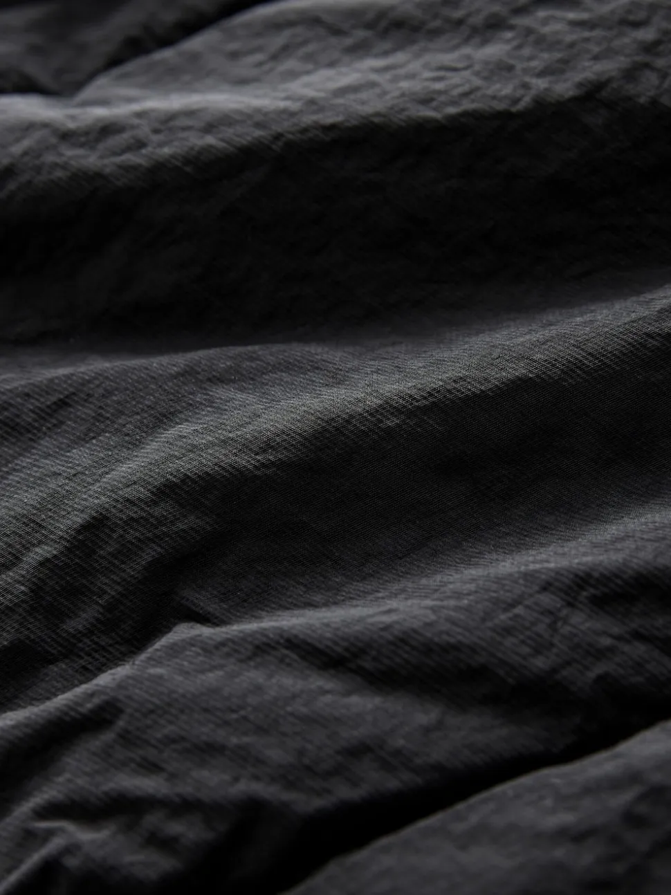 Zwart - Regenbestendige bodywarmer met capuchon en gebreide kraag