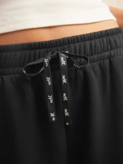 Zwart - self. joggingbroek met wijde pijpen