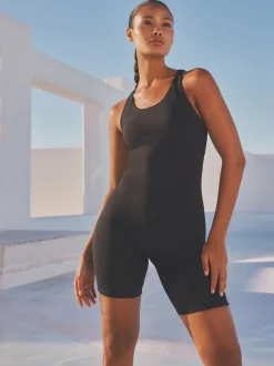 Zwart - Unitard buikcorrigerend badpak