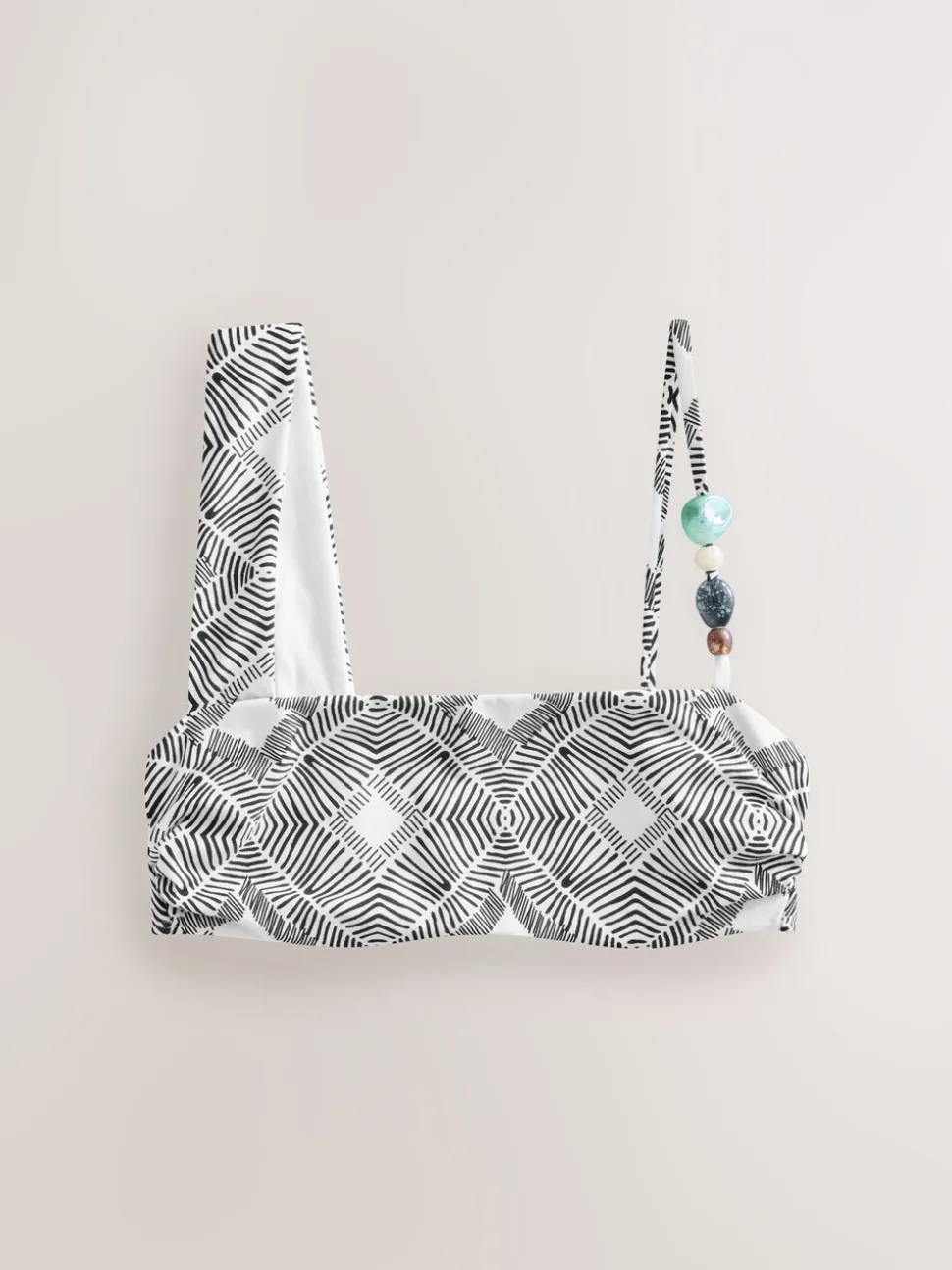 Zwart/crème met aztekenprint - Asymmetrische bikinitop met kralen