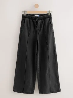 Zwarte wassing - Denim joggingbroek met plooitjes en wijde pijpen