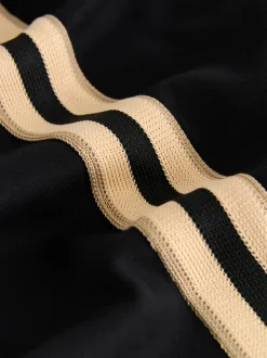 Zwart/neutraal - Slinky trainingsbroek met wijde pijpen en zijstrepen