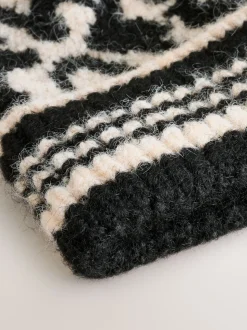 Zwart/wit met dierenprint - Gebreide muts met pompon