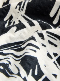 Zwart/wit met palmboomprint - Halflange jersey jurk met knoopsluiting